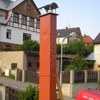 Rekonstrukce komínového průduchu v Trutnově, montáž komínového nástavce - imitace cihla.